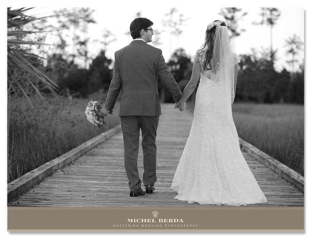 My clients married and happy walking down the dock at The Daniels Island Club, as they walk away with the joy I captured this photo, and the groom such a gentlemen carrying the bouquet makes this image that much more special. 